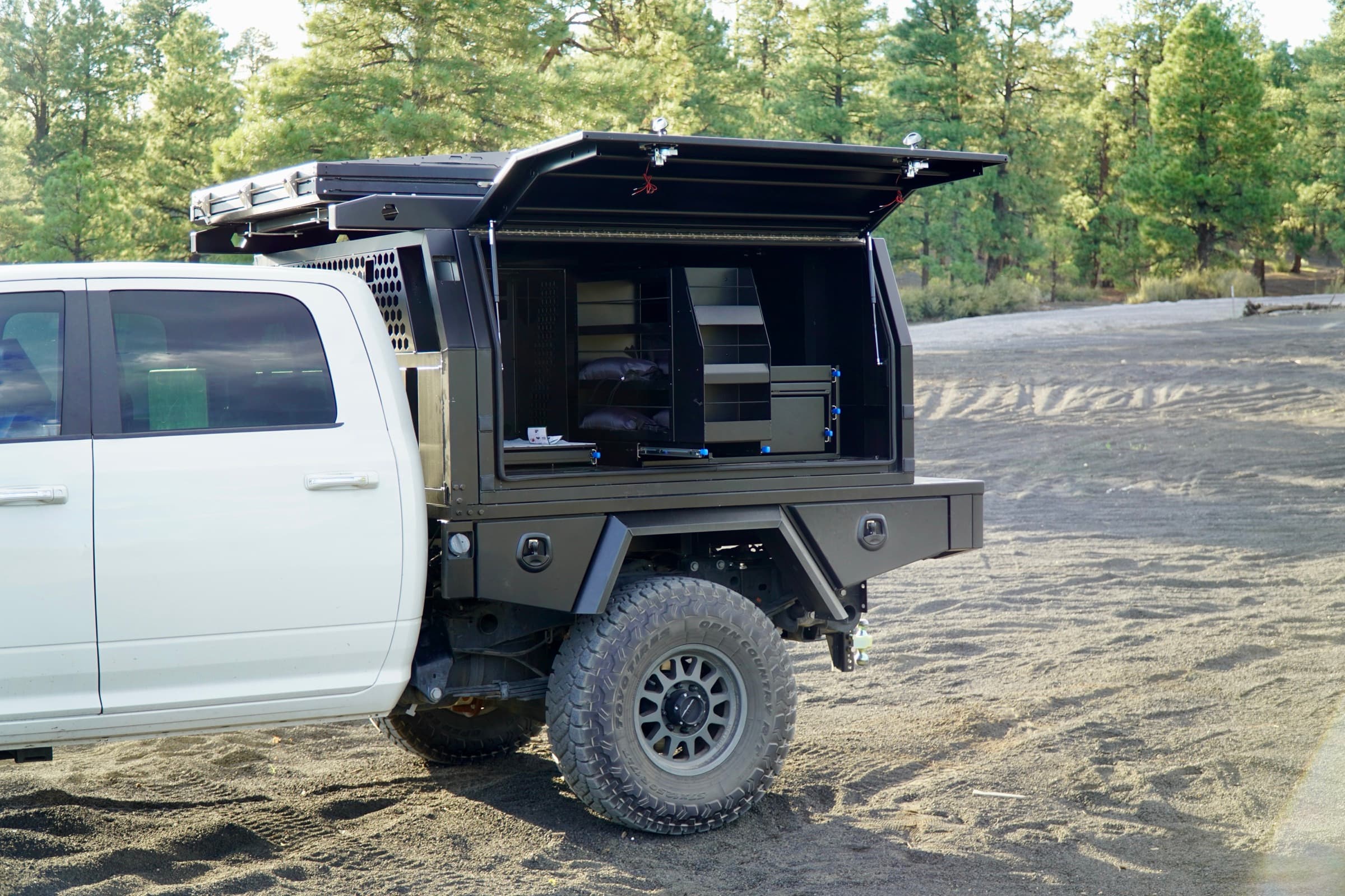 Touring canopy on Ram with side door open showing drawer and rack storage
